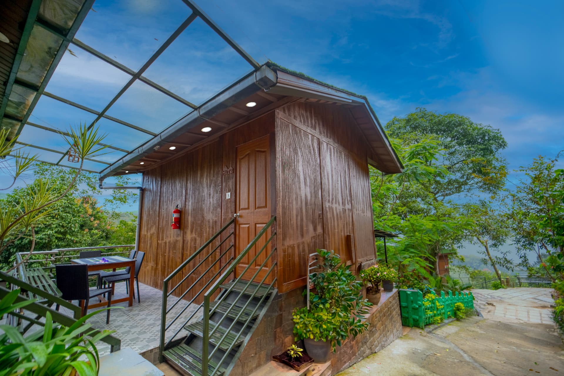 Glass-roofed terrace outside a Premium Valley View Hut