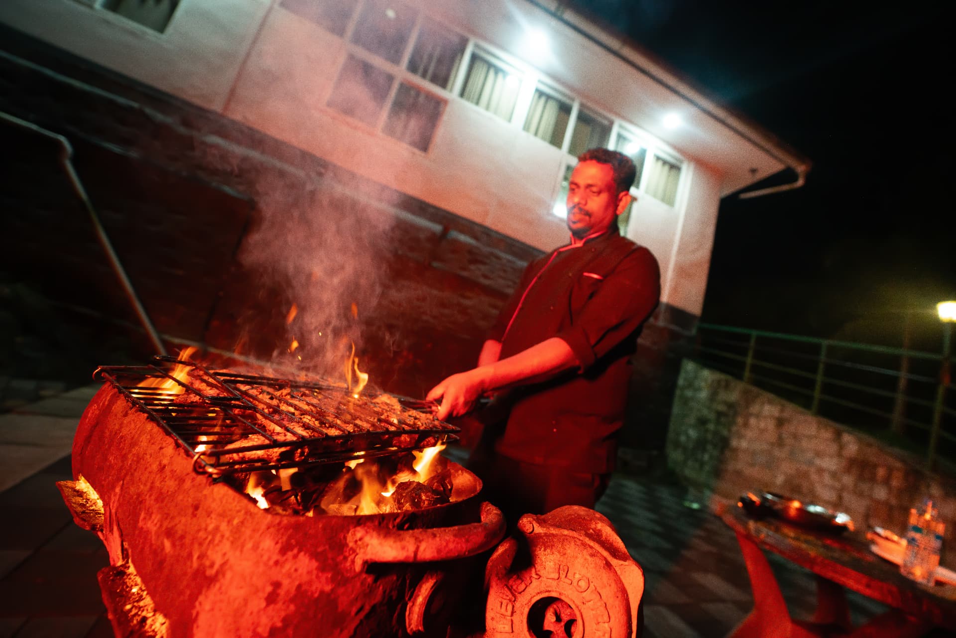 Campfire under the stars at Grand Valley Resort, Munnar