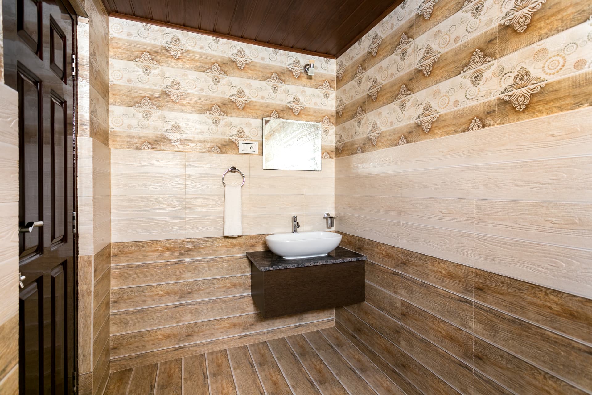 Tiled bathroom of the Premium Valley View Room with vessel sink and mirror
